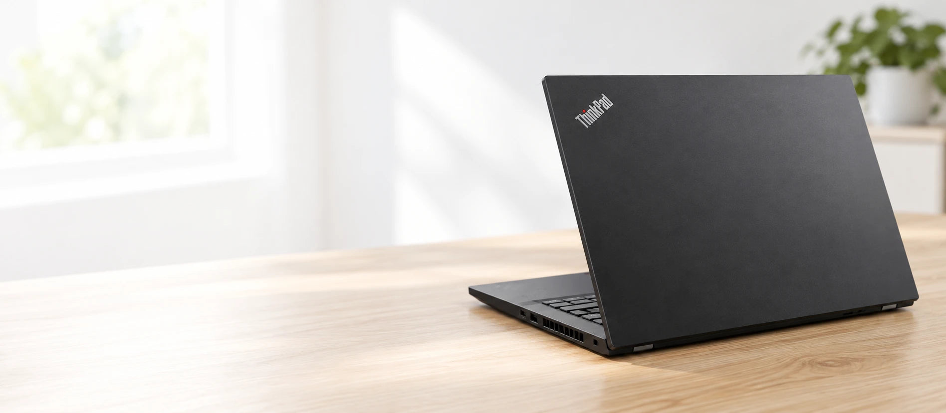 Lenovo ThinkPad T14 Gen 2 laptop seen from behind on a desk