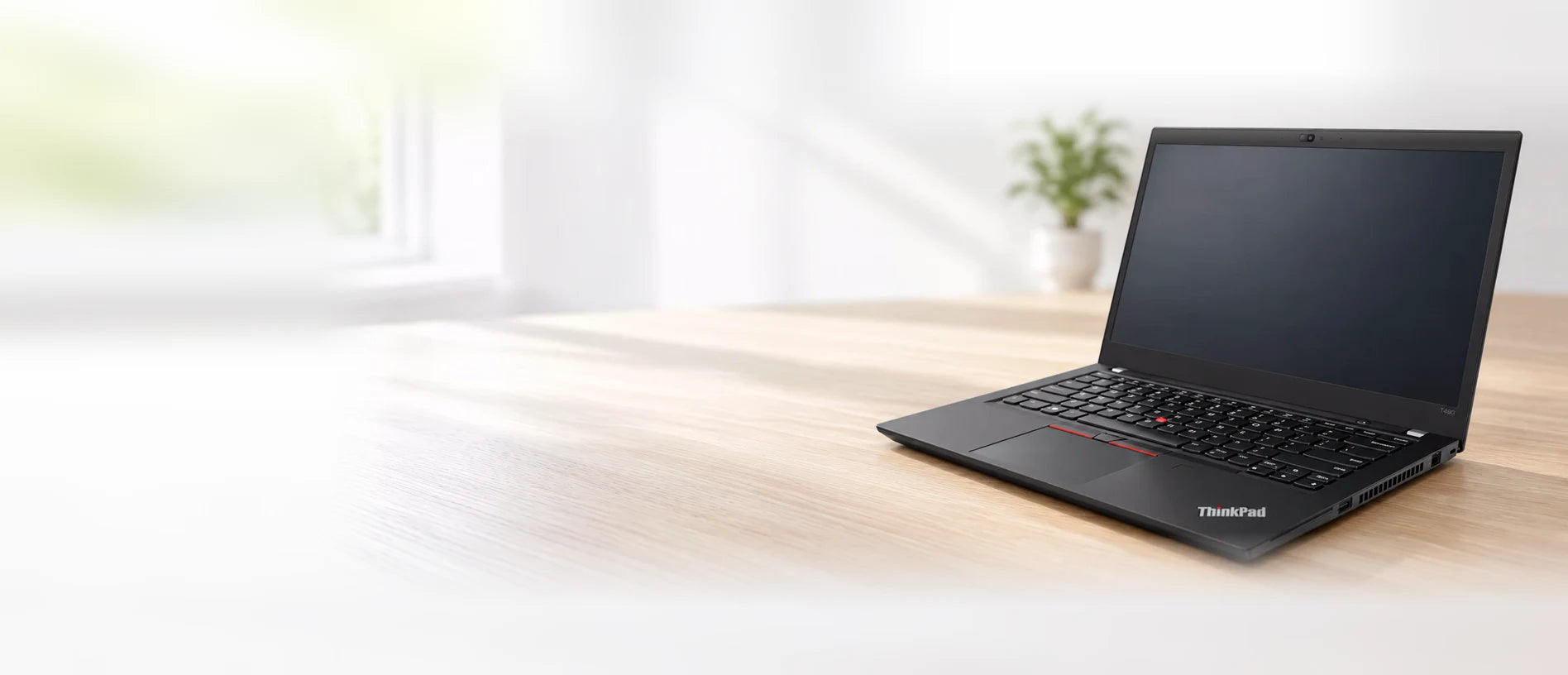 Lenovo ThinkPad T490 laptop open on a desk